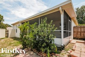 Valrico house for rent - the backyard of a house with a patio and trees