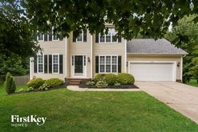 Charlotte house for rent - the front of a house with a driveway and a lawn