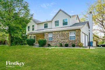 Pickerington house for rent - a white house with green shutters and a lawn in front