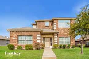 Lancaster house for rent - A brick house with a tree in front of it.