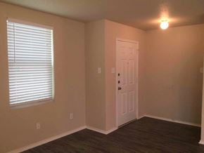 Cedar Hill house for rent - an empty room with a white door and a window