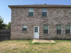 Cedar Hill house for rent - an old brick building with a white door and windows