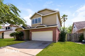 Missouri City house for rent - A house with a garage and a driveway is shown in the image.