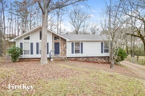 Birmingham house for rent - a white house with blue shutters and a gravel driveway