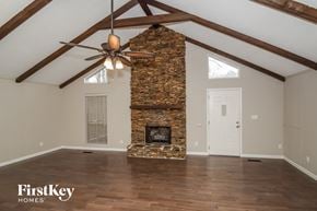 Birmingham house for rent - the living room of a home with a stone fireplace