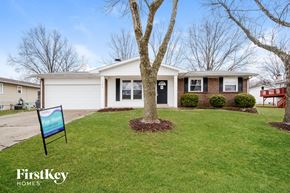 Saint Charles house for rent - A house with a lawn and a sign that says FirstKey Homes.