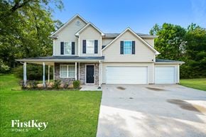 Covington house for rent - a white house with blue shutters and a driveway