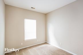 Fishers house for rent - a bedroom with white walls and a window