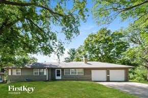 Kansas City house for rent - A house with a tree in front of it.