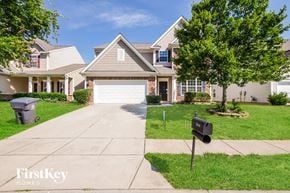 Charlotte house for rent - a suburban house with a white garage door