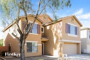 Litchfield Park house for rent - a house with a tree in front of it