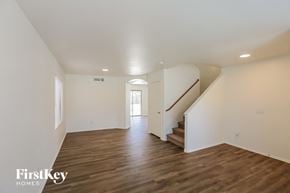 Litchfield Park house for rent - a renovated living room with white walls and wood floors