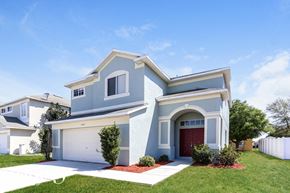 Riverview house for rent - a blue house with a garage and a lawn