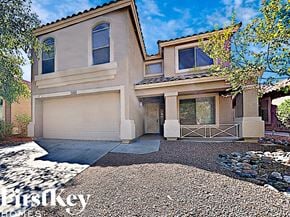 Litchfield Park house for rent - a house with a driveway and a garage door