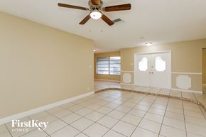 Plantation house for rent - A spacious room with a fan and tiled flooring.
