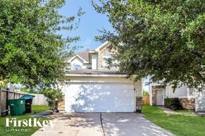 Houston house for rent - a white garage door in front of a house