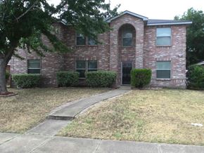 Cedar Hill house for rent - a brick house with a sidewalk in front of it