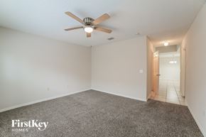 Gibsonton house for rent - the living room of an empty house with a ceiling fan