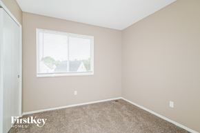 Black Jack house for rent - the bedroom of a home with a window and carpet