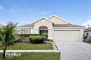 Riverview house for rent - a house with a palm tree in front of it