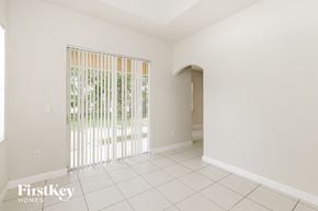 Miramar house for rent - a living room with a sliding glass door and a tiled floor