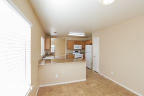 El Mirage house for rent - a large kitchen with a counter top and a sink