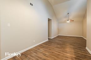 Houston house for rent - A room with wooden flooring and a ceiling fan.