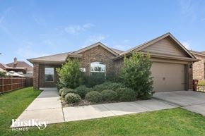Royse City house for rent - a brick house with a sidewalk in front of it