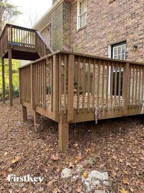 Conyers house for rent - a wooden deck in front of a brick building