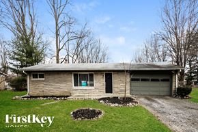 Indianapolis house for rent - A house with a garage and a driveway in front of it.