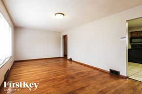 Indianapolis house for rent - A room with wooden floors and a white ceiling.