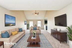 Houston house for rent - A living room with a couch, a chair, a coffee table, and a television.