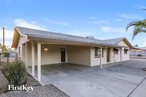 Tempe house for rent - A house with a garage and a driveway is for sale.