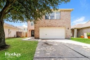 Houston house for rent - A house with a garage and a tree in front.