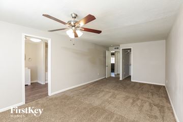 Phoenix house for rent - a living room with a ceiling fan and a carpet