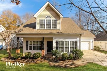 Huntersville house for rent - the front of a house with a porch and a driveway