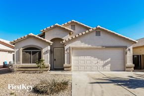 San Tan Valley house for rent - a home with a white garage door and a driveway