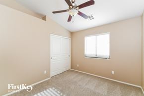 San Tan Valley house for rent - the master bedroom has a ceiling fan and a closet
