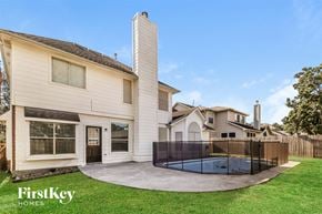 Tomball house for rent - A house with a pool in the backyard.