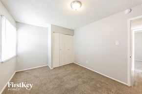 Glendale house for rent - A bedroom with a carpeted floor and a closet.
