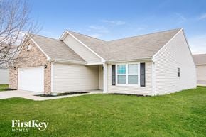Fishers house for rent - A house with a garage and a driveway is for sale.