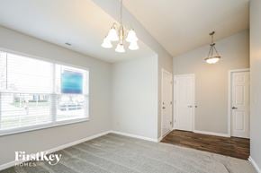 Fishers house for rent - A room with a carpeted floor and a window with blinds.