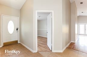 Jacksonville house for rent - an empty hallway with a door to a bedroom and a door into a hall way