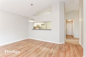 Jacksonville house for rent - the living room and dining room with hardwood flooring