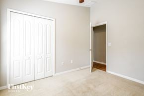 Riverview house for rent - a bedroom with two closets and a door to a hallway