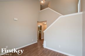 Lawrenceville house for rent - A room with a staircase leading to another room.