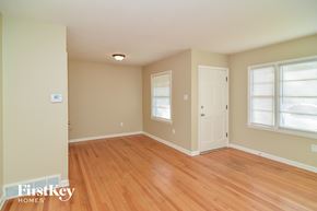 Memphis house for rent - a living room with a wooden floor and a white door