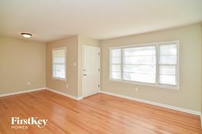 Memphis house for rent - a living room with a wooden floor and a window and a door