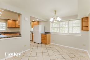 Winthrop Harbor house for rent - a kitchen with a white refrigerator and a sink