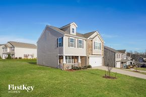 Kernersville house for rent - A large house with a lawn in front of it.
